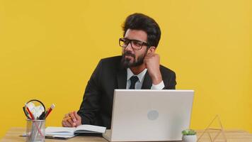 Indian businessman making notes, writing down thoughts with pen into notepad notebook diary video