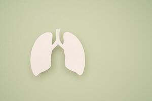 Close-up of a lung symbol on a green background with space for text. photo