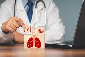 Close-up of a doctor is holding a wooden cube while sitting in the hospital. photo
