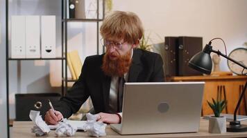 Angry furious man working at home office throwing crumpled paper, having nervous breakdown at work video