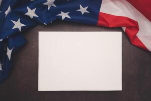 Part of the American flag and a blank white paper on a vintage background photo