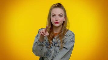 Pretty adult girl pointing to camera and looking with playful happy expression, making choice video