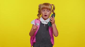 Pupil schoolgirl making mobile phone call to mother, discussing very pleasant and interesting topic video