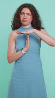 Tired upset young woman showing time out gesture, limit or stop sign, bored of work, take a break video