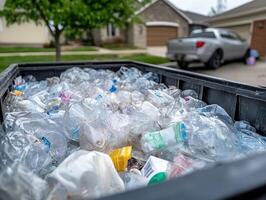 A close-up view of a dumpster filled with plastic waste, highlighting the issue of recycling and waste management in a suburban setting. photo