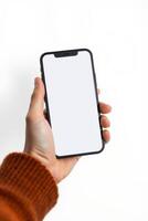 Person holding a modern smartphone with a blank white screen display photo