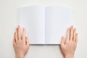 Open Blank Notebook. Hands holding an open blank notebook photo