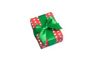 Wrapped christmas other holiday handmade present in paper with colored ribbon. Present box, decoration of gift on table, top view photo