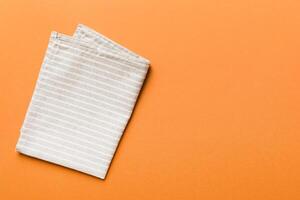 top view with gray kitchen napkin isolated on table background. Folded cloth for mockup with copy space photo
