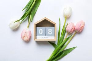 8 March, International Women's Day. greeting card design with tulips and calendar , with copy space photo