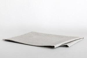 top view with gray kitchen napkin isolated on table background. Folded cloth for mockup copy space, Minimal style photo