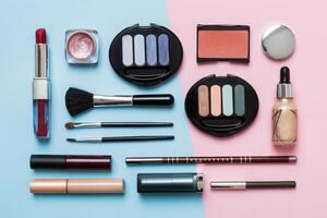 Professional makeup tools. iew. Flat lay. Beauty, decorative cosmetics. Makeup brushes set and color eyeshadow palette on table background. Minimalistic style photo