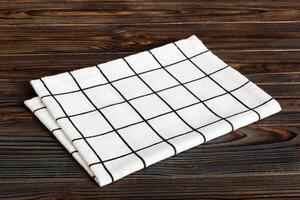 top view white empty kitchen napkin isolated on table background. Folded cloth for mockup with copy space, Flat lay. Minimal style photo