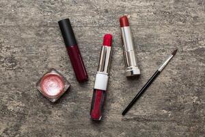 Professional makeup tools. Flat lay. Beauty, decorative cosmetics. Makeup brushes set and color eyeshadow palette on table background. Minimalistic style photo