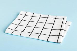 top view with white empty kitchen napkin isolated on table background. Folded cloth mockup with copy space, Minimal photo