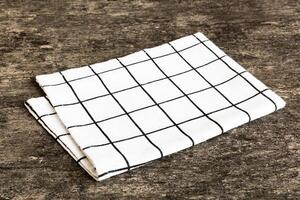 top view with white empty kitchen napkin isolated on table background. Folded cloth mockup with copy space, Flat lay. Minimal style photo