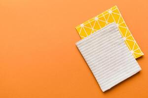 top view with gray kitchen napkin isolated on table background. Folded cloth for mockup with copy space, Minimal style photo