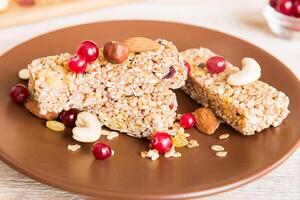 Various granola bars table background. Cereal granola bars. Superfood breakfast bars with oats, nuts and berries. Superfood concept photo