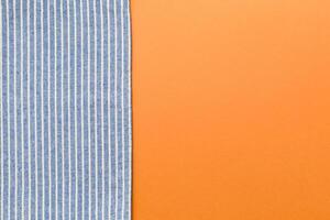 top view with blue kitchen napkin isolated on table background. Folded cloth for mockup with copy space, photo