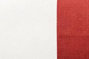 top view with red empty kitchen napkin isolated on table background. Folded cloth mockup with copy space. Minimal style photo