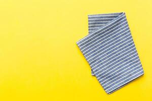 top view with blue kitchen napkin isolated table background.Folded cloth for mockup with copy space photo