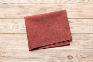 top view red empty kitchen napkin isolated on table background. Folded cloth for mockup with copy space, Flat lay. Minimal style photo