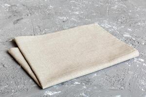 top view with gray kitchen napkin isolated table background. Folded cloth for mockup with copy space, Flat lay. Minimal style photo