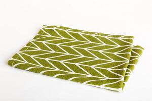 top view with green kitchen napkin isolated table background. Folded cloth for mockup with copy space, Flat lay. Minimal style photo
