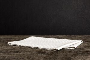 top view with gray kitchen napkin isolated table background. Folded cloth for mockup with copy space, Minimal style photo