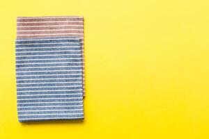 top view blue kitchen napkin isolated on table background. Folded cloth for mockup with copy space, Flat lay. Minimal style photo