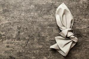 top view gray kitchen napkin isolated table background. Folded cloth for mockup with copy space, Minimal style photo