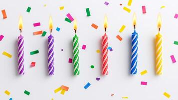 Colorful Party Candles with Confetti Background for Celebrations and Festive Occasions photo