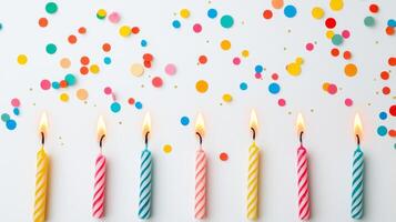 Colorful Birthday Party Candles with Confetti Background Celebrating Special Occasions and Festive Moments photo
