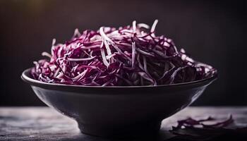 Closeup macro shot of shredded cabbage in bowl, black background for contrast. photo