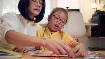 Mother and child enjoying colorful learning activity in homeschool setting video