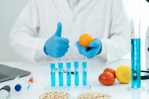 Scientist guaranteer no chemical on fruit residues in laboratory. Control experts inspect the concentration of chemical residues, standard, find prohibited substances, contaminate photo