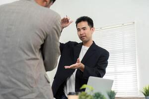 Engaging Presentation and Idea Sharing. A professional explaining project concepts to a colleague in a modern office. photo