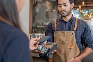 female use smartphone to scan QR code to pay in cafe restaurant with a digital payment without cash. Choose menu and order accumulate discount. E wallet, technology, pay online, credit card, bank app. photo