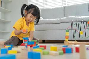 Happy Asia children play and learn toy blocks.family is happy and excited in the house. daughter having fun spending time, Activity, development, IQ, EQ, meditation, brain, muscles, essential skill photo