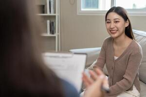smiling after consult Psychiatrist ,mental health problems, psychiatrist is recording the patient's condition for treatment. encouragement, love problem, bipolar , depression patient, suicide photo
