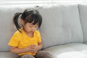 stomach ache, Children have abdominal pain, indigestion, gastritis, menstrual cramps, flatulence, diarrhea, distention, colon cancer, belly inflammation problem, suffer food poisoning, abdomen photo