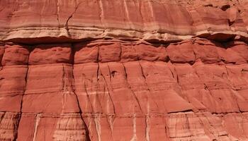Rock Formation Displaying Vivid Red Earth Layers and Erosion Patterns photo