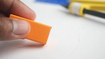 Creating art with a simple orange eraser and drawing tools in studio video