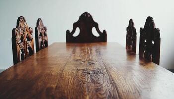 Ornate Wooden Table With Intricately Carved Chairs photo