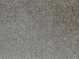The texture of the tile is matte, with small gray-black stone and sand grains, giving it a non-glossy feel. It is smooth, luxurious, and beautiful, making it look realistic. photo