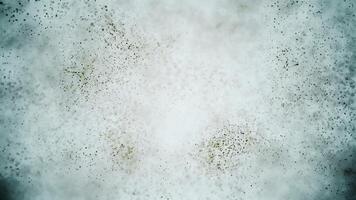 Earthy green and brown particle background. Gently swirling particles abstract background. video