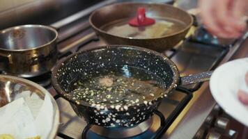 Chef Tests To Check If Boiling Oil Is At Temperature For Frying Turkey Sausage video