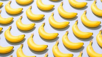 Playful banana diagonal pattern on a soft pastel background giving a tropical and minimal summer mood photo