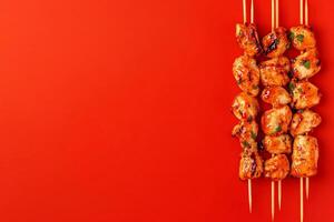 Top View Of Chicken Skewers With Peanut Sauce On Vibrant Background With Copy Space, Food Photography photo