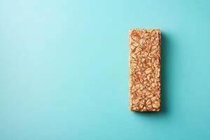 Top View Of Peanut Butter Energy Bar On Vibrant Background With Copy Space, Food Setting photo
